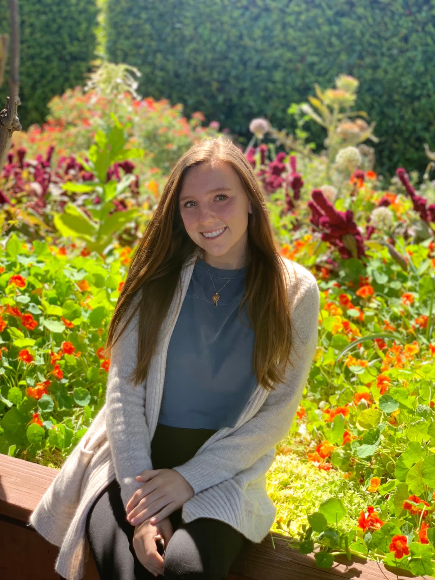 Ashton Gerardi, occupational therapist, seated in a garden